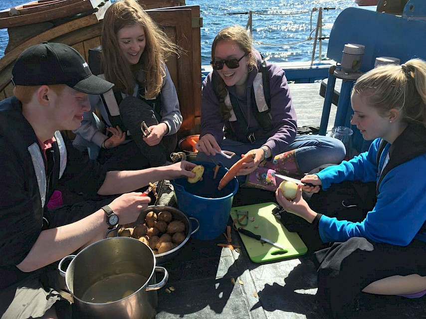 STS Trainees preparing food on deck