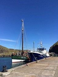 Swan berthed alongside Fair Isle Ferry