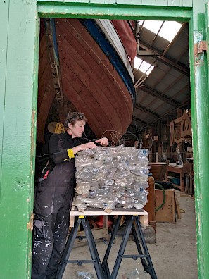 Artist Julia Barton working on one of her #LitterCUBES