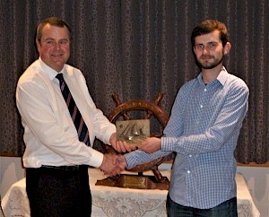 Swan Sail Trainee of the Year, Drew Manson, received his Vevoe Trophy from Aubrey Jamieson