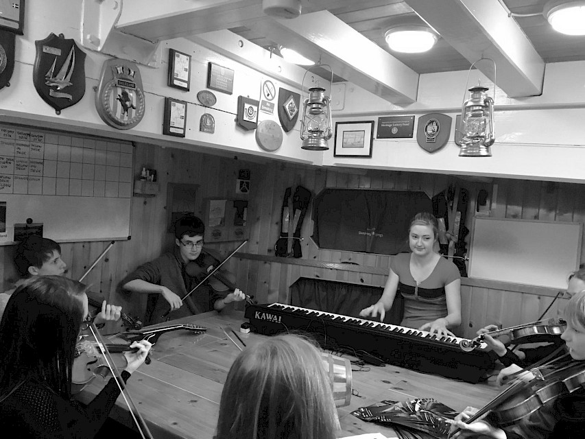 Musicians playing aboard during Shetland Folk Festival 2019