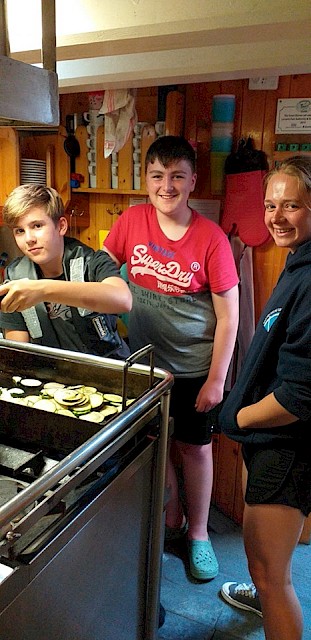 One Step Beyond trainees getting to grips with the galley, under the supervision of our Mate, Maggie Adamson