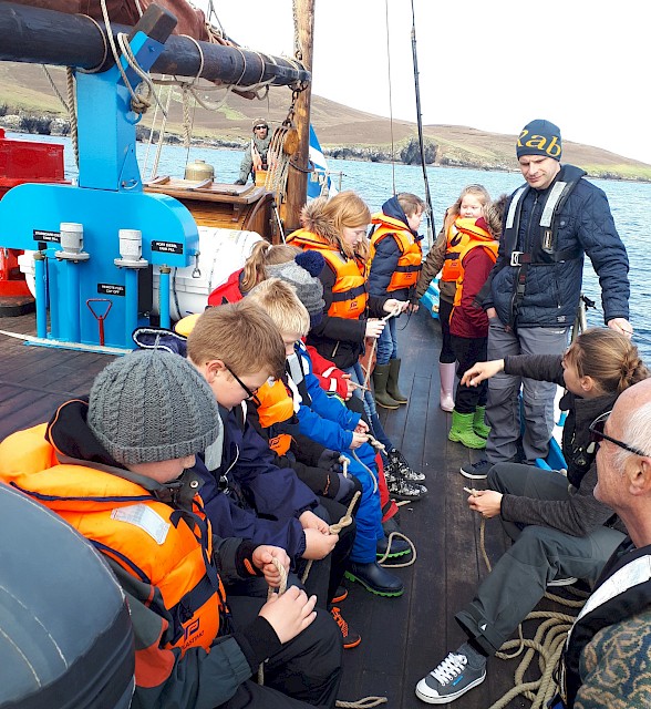 Teaching school pupils how to tie various knots