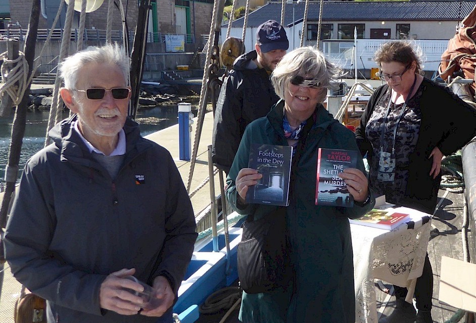Swan Trust Trustee, Mary Irvine with her husband Joe and copies of Marsali’s books