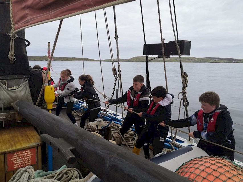 All hands ready? Haul away! The pupils haul in the bow sprit