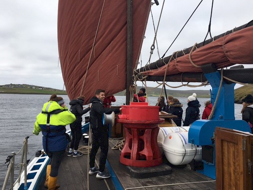 One of the sails going up during a trip with Mid Yell pupils