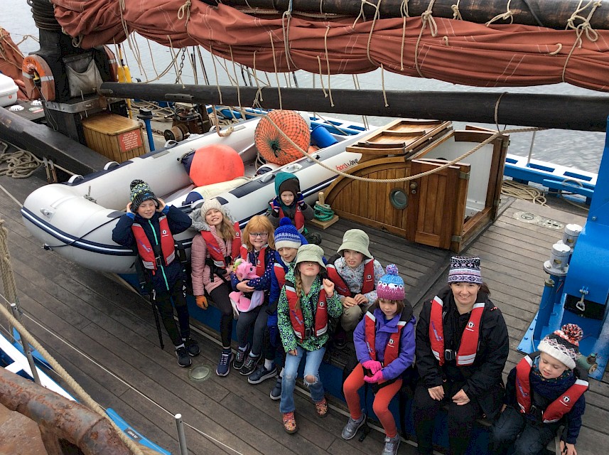 Burravoe School pupils and teacher aboard the Swan