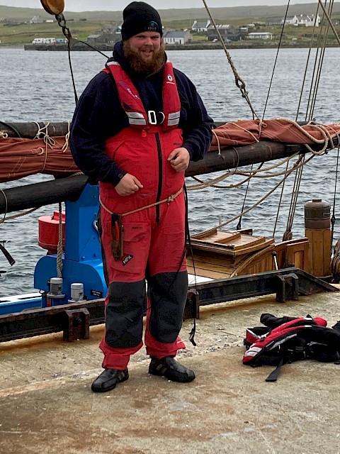 Scott beside the Swan earlier this year, following another successful trip with pupils from the Baltasound School