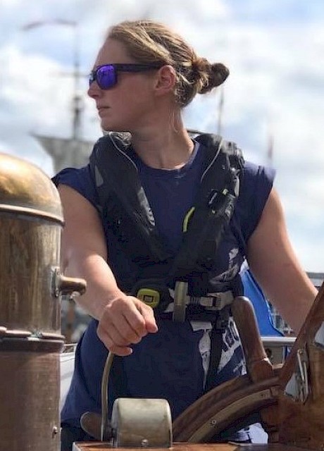 Maggie at the helm in 2018 during the Tall Ships Races. Image credit: Molly Tulloch