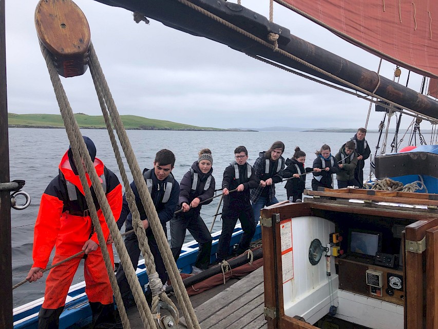 Working as a team aboard the Swan during a sail training taster day in 2021