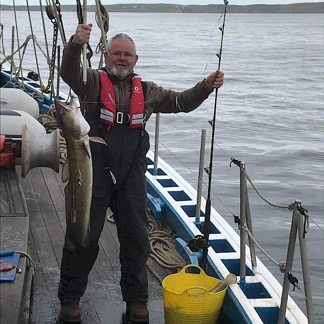 Peter Robertson landing a good size fish aboard the Swan