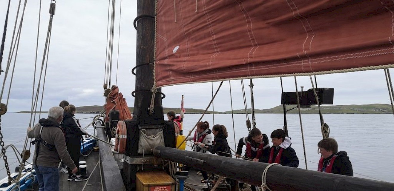 Haul Away! Whalsay school pupils haul in the bow sprit
