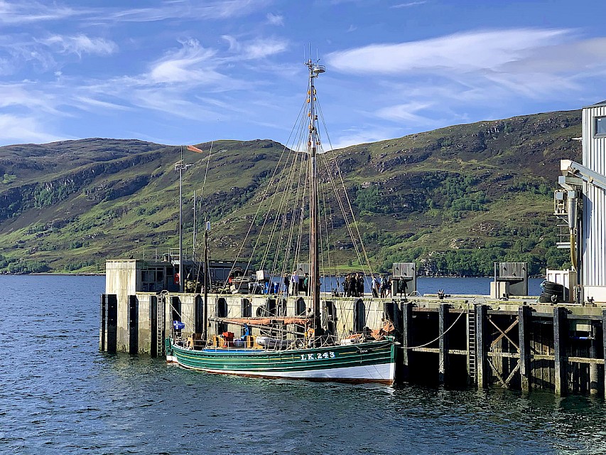 Swan in Ullapool, waiting to take youth trainees aboard. Image, Noel Hawkins