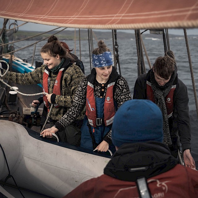 Swan Trainees aboard the Swan wearing Mati Ventrillon knitwear, photographed by @kletspoot