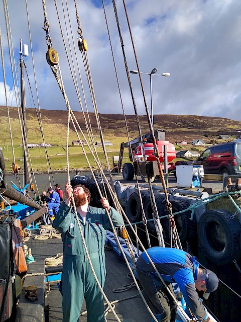 The Swan's Mate, Scott, clears halyards as they go up