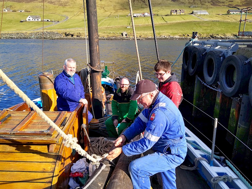 The peak halyard is attached to the gaff