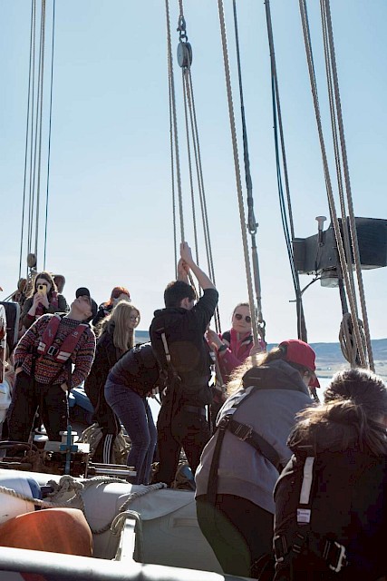 Trainees raising one of the sails. Image: Lakota Clubb